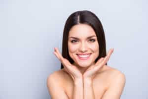 A woman smiling and showing off her BOTOX results